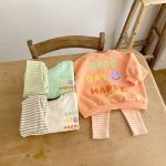 [66-90cm]スウェット スマイル柄 英字 可愛い トップス